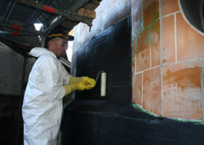 applying carbon fiber wrap to tile tank