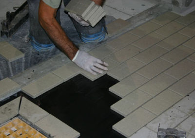 laying a vitrified tile floor
